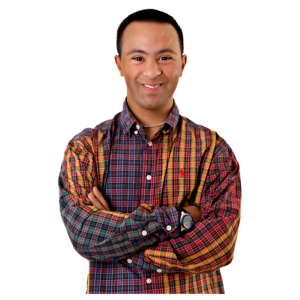 a person standing smiling in a checked shirt with his arms crossed