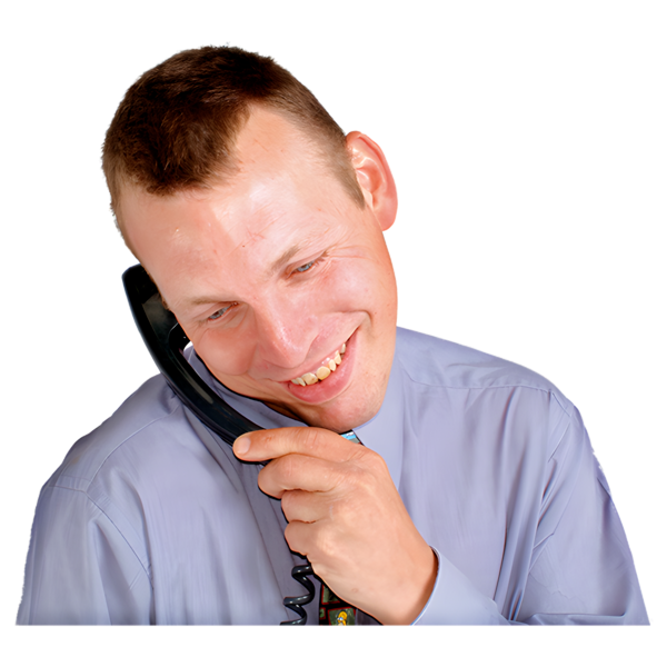 A man talking smiling and holding a phone to his ear