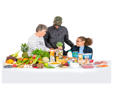 Three people in front of a table with lots of different foods