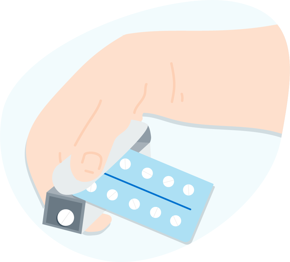 Person pushing out pills from a blister pack