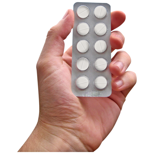 Hand holding a packet of tablets