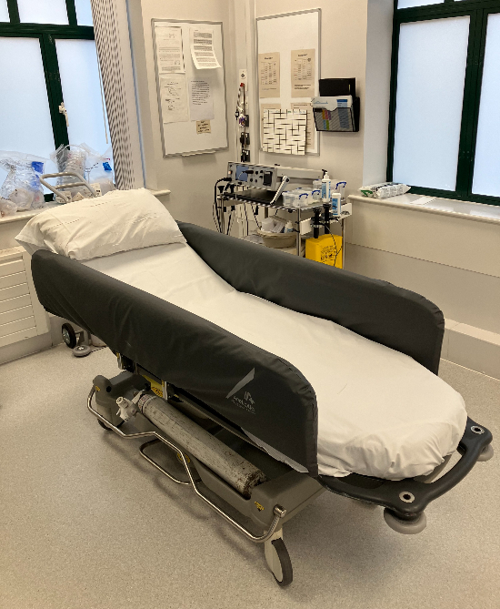 Treatment room with bed and clinical machines