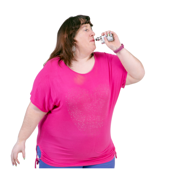 Woman in a pink shirt using a vape