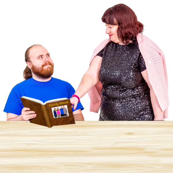 Two people looking through a photo album