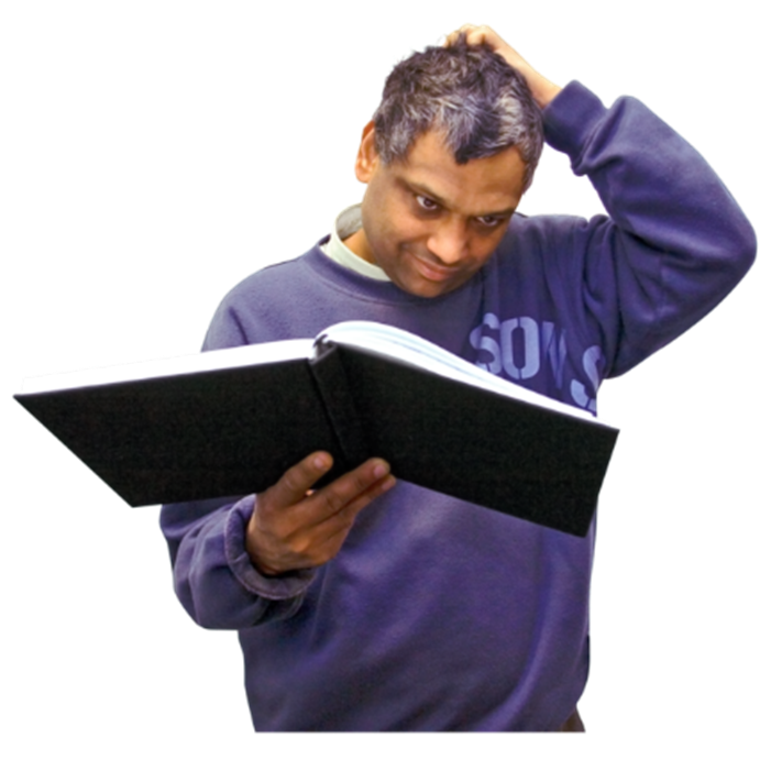 A person holding an open book and looking distracted