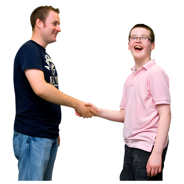 Two smiling people shaking hands, one wearing a dark blue T-shirt and jeans, the other in a pink polo shirt and shorts.