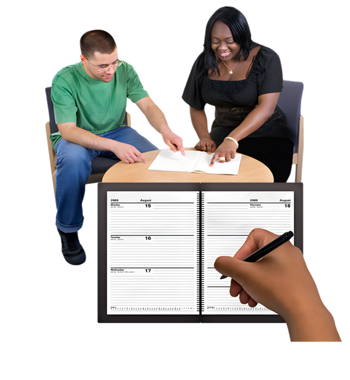 Two people sat at a table and a diary in front of them.