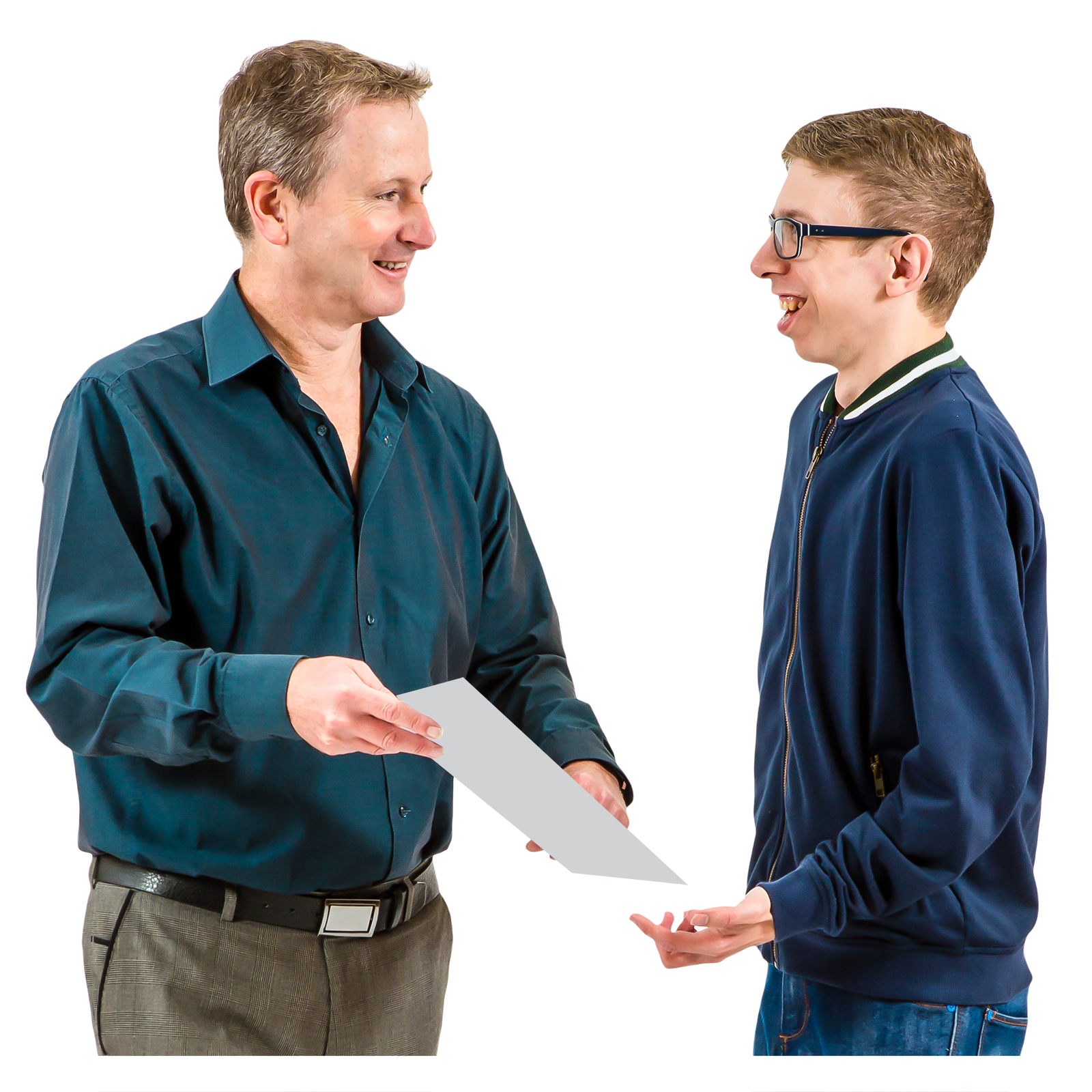 Two men smiling and exchanging a piece of paper.