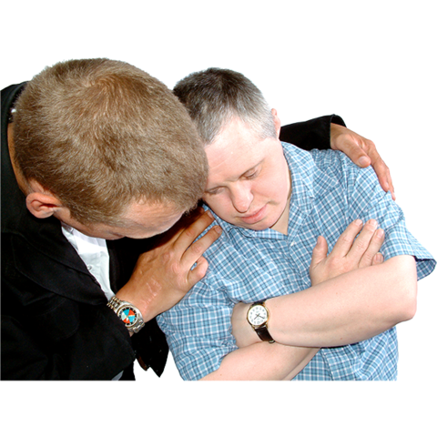 A person with their arm around another person