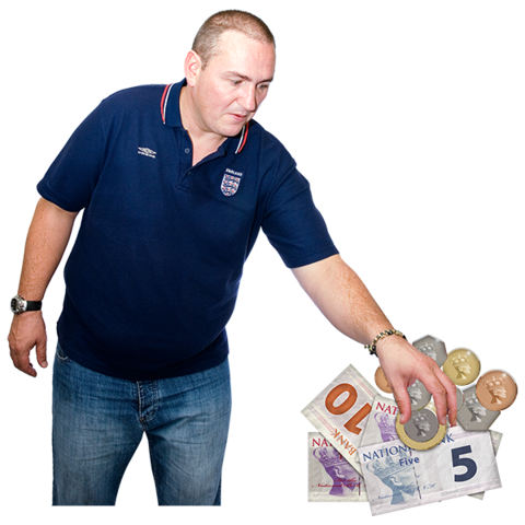 A person picking up cash