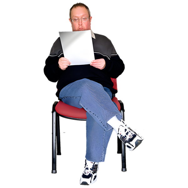 a person sitting on a chair reading a document