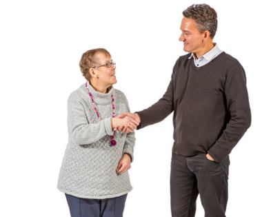 A man shaking hands with a woman