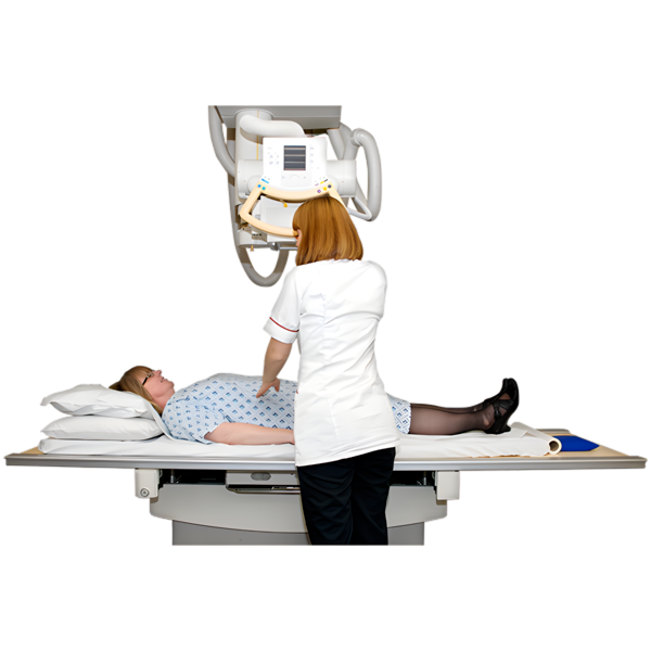 A person lying under an xray machine with a nurse performing the 