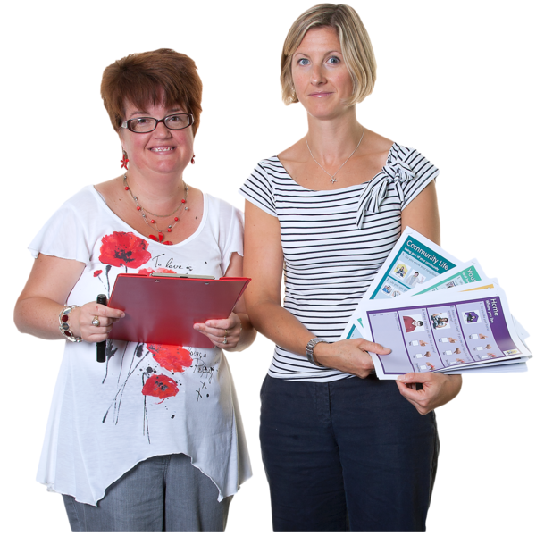 Two woman holding various leaflets and documents