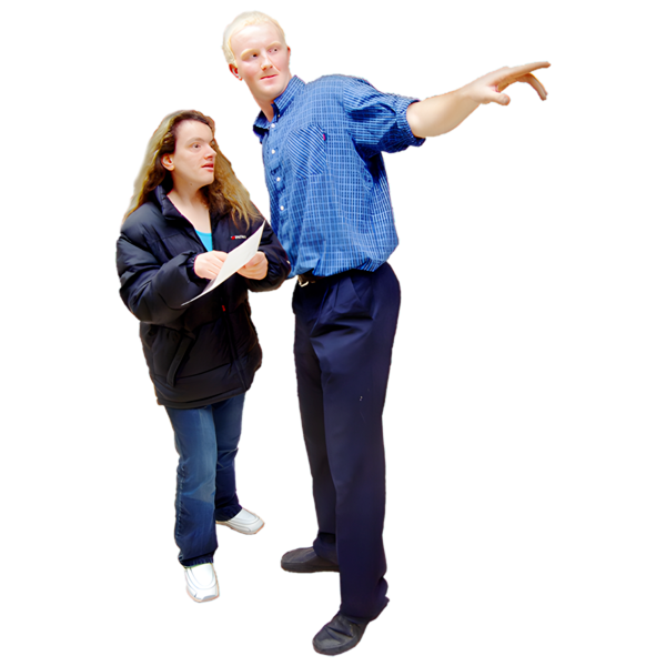 A man pointing while giving directions to another person