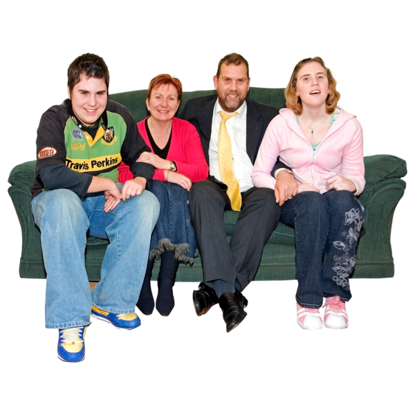 A family sitting on a sofa together