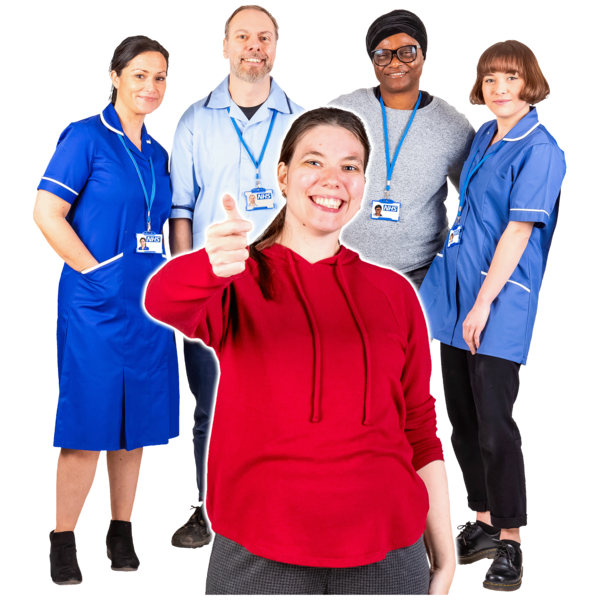 A patient with a group of staff behind her