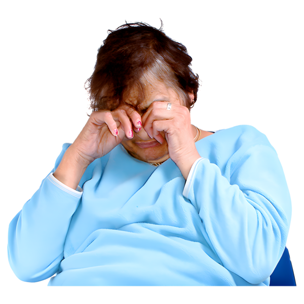 A person crying with their hands covering their eyes
