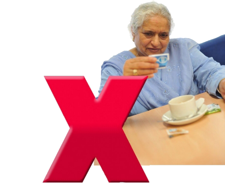 A person making a cup of tea. Covering the image is a big red cross.