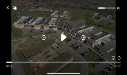 A screenshot of the film with a play button in the middle.