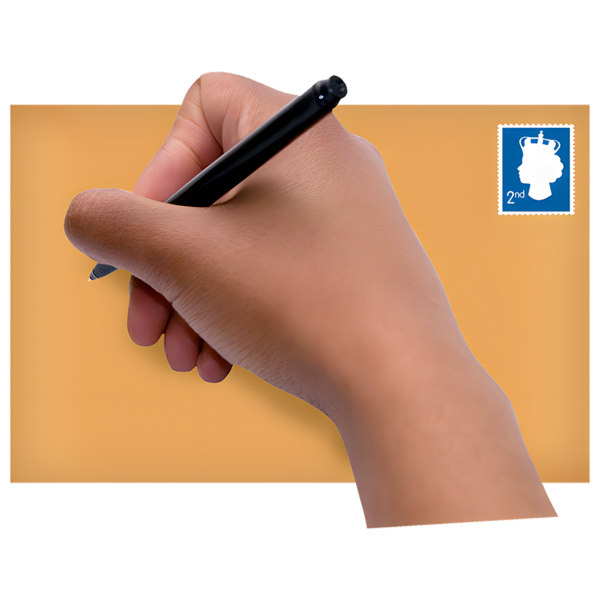 Close up of a hand writing on an envelope