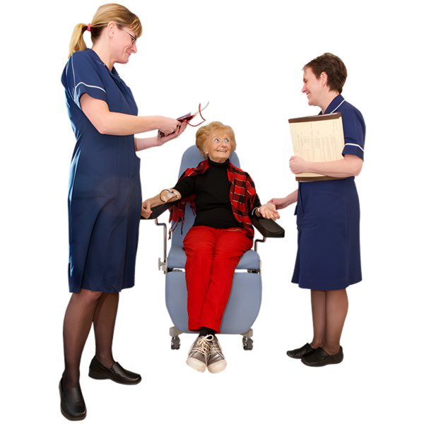 patient sitting in a chair talking to two nurses