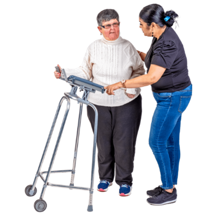 Someone with a walking aid being supported by a carer