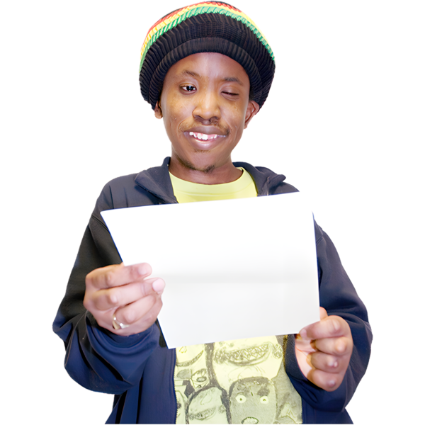 A person wearing a colorful beanie and dark jacket, looking at a piece of paper.