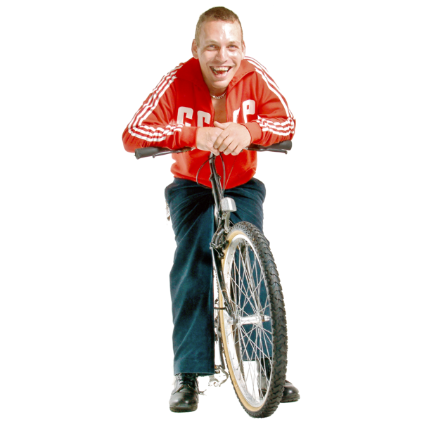 A person smiling and sitting on a bike