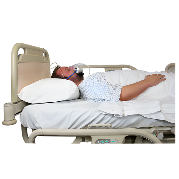 Man lying in a hospital bed with an oxygen mask on his face