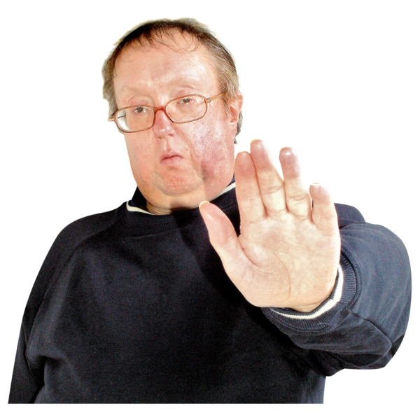 Man wearing glasses making a stop gesture with his hand.