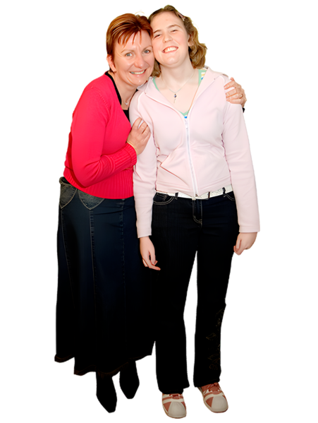Two women standing closely together, smiling, against a white background.