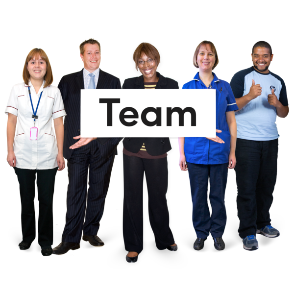 A group of people. The person in the middle is holding up a sign saying Team.
