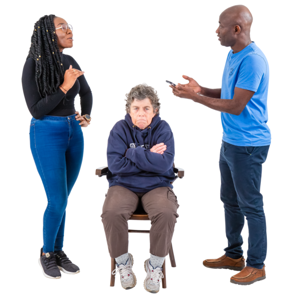 Three people having a heated discussion, with an older person seated in the center and two younger individuals standing on either side.