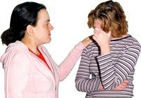 A woman comforting an upset woman