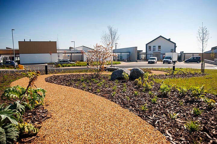 A photo of the Barton Centre and the path leading up to it on a sunny day.