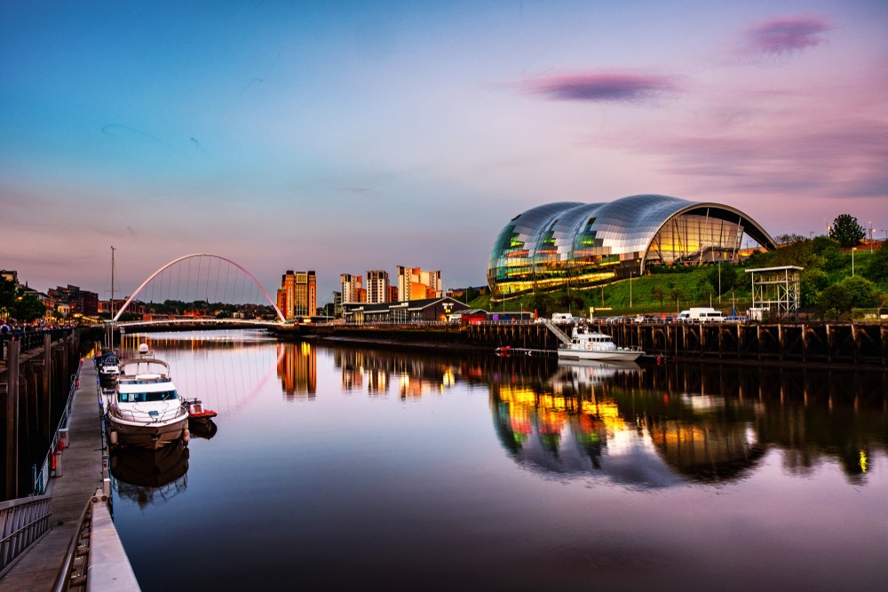 Image of Newcastle quayside with the millenium bridge and The Glasshouse on the Gateshead side
