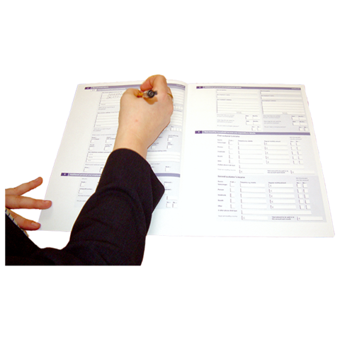 Close up of a hand filling in a form