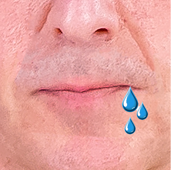 Close up of a mouth with water droplets