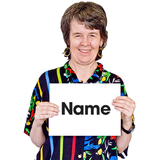 A person holding a sign with Name written on it