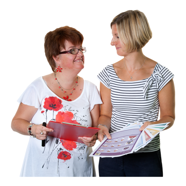 Two women discussing while holding a tablet and papers.