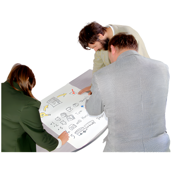 Three people collaborating over a large sheet of paper with various hand-drawn diagrams.