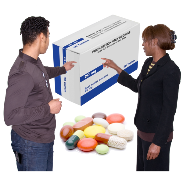 Two professionals discussing a large box of prescription medicine with various pills in the foreground.